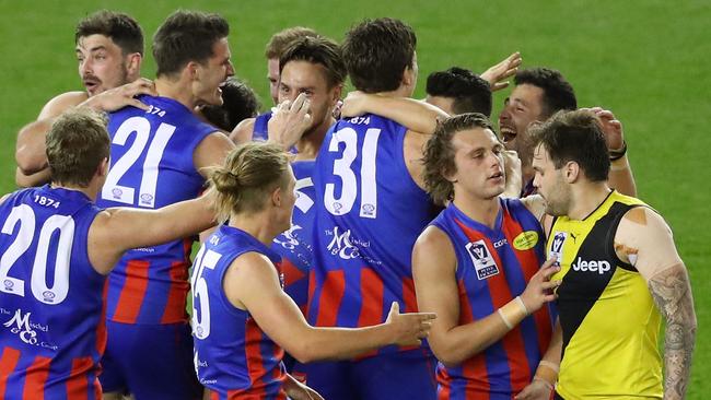 Ben Lennon is consoled by Ashley Krakauer. (Photo by Scott Barbour/AFL Media/Getty Images)