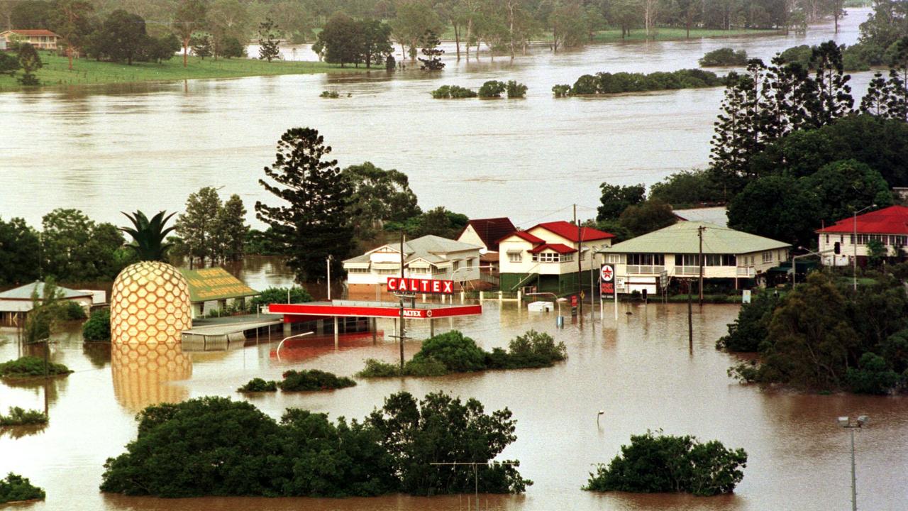 Gympie’s isonic pineapple reflects on the floodwaters in 1999.