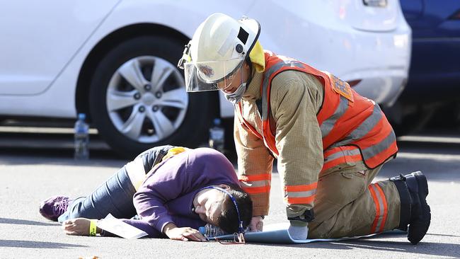 An Emergency Services worker tends to an ‘injured’ person during the recent mock terrorist exercise at Adelaide Oval. Picture: Sarah Reed