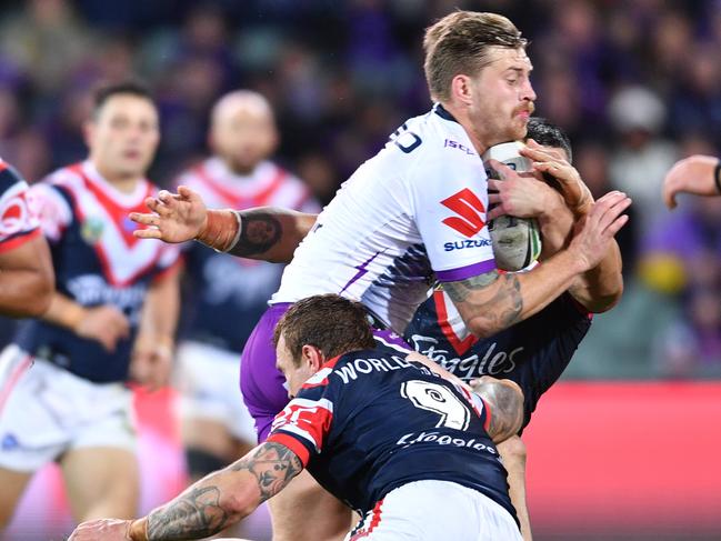 Cameron Munster makes a rare run for the Storm in the match against the Roosters. Picture: AP Image