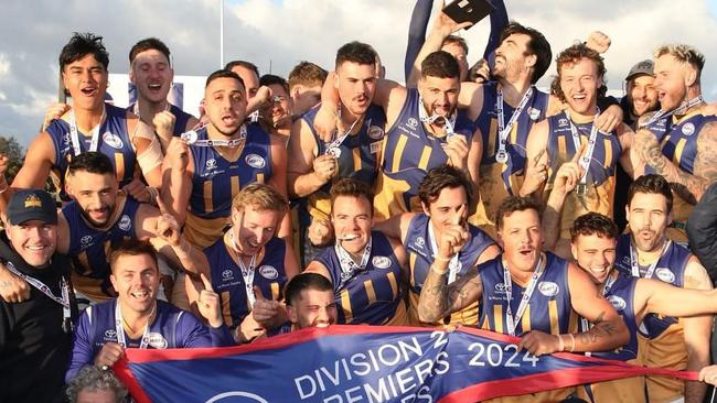 Sunshine celebrate their premiership. Photo: WFNL.