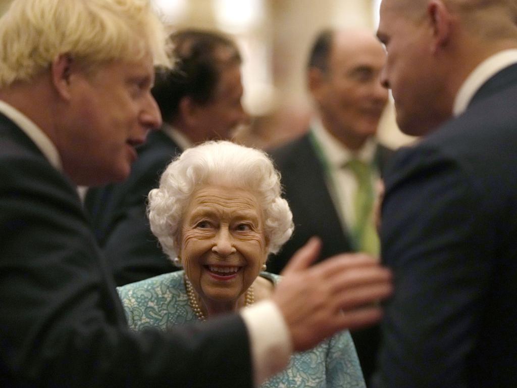 Britain's Queen Elizabeth II and Prime Minister, Boris Johnson greet guests during a reception at Windsor Castle in 2021. Picture: Getty Images