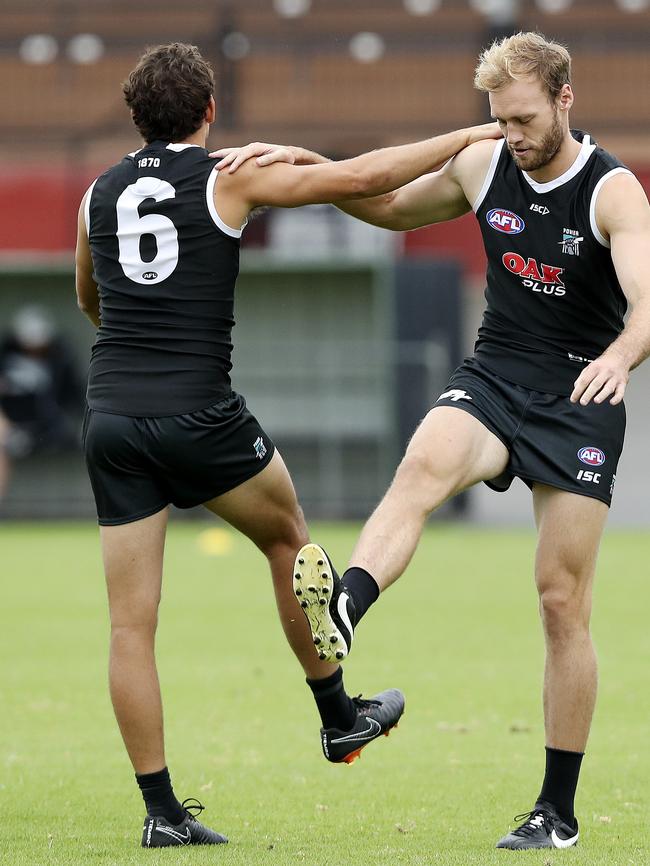 Port’s Steven Motlop and Jack Hombsch warm up at training. Clubs are putting ridiculous restrictions on player traning loads. Picture: Sarah Reed