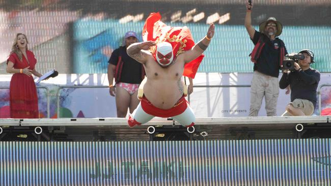 JJ Taiki dives off the stage dressed as “Nacho Libre” Picture: Tony Gough