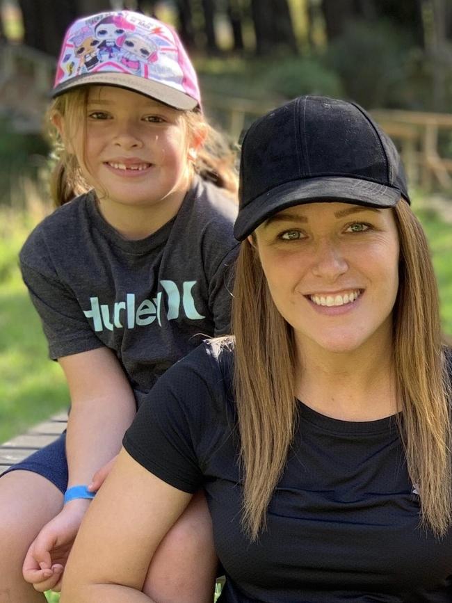 Nicole Olsen, with her daughter Harper, 6. They found eight puppies in zip-locked bags inside a bin on Sunday. Pictures: Nicole Olsen