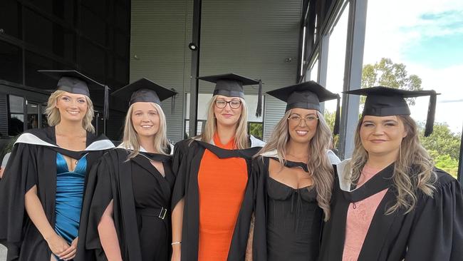 Graduates from the University of the Sunshine Coast's Fraser Coast campus celebrating at the Brolga Theatre.