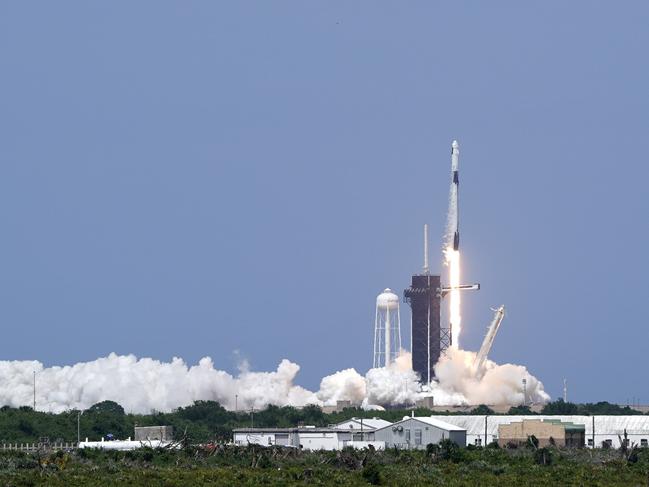 A SpaceX Falcon 9, with NASA astronauts Doug Hurley and Bob Behnken in the Crew Dragon capsule, lifts off from Pad 39-A at the Kennedy Space Center in Cape Canaveral, Fla., Saturday, May 30, 2020. The two astronauts are on the SpaceX test flight to the International Space Station. For the first time in nearly a decade, astronauts blasted towards orbit aboard an American rocket from American soil, a first for a private company. (AP Photo/David J. Phillip)