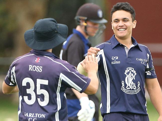 Premier Cricket: Carlton v Melbourne University, Matthew Wilson of Carlton (right) celebrates after taking the wicket of Jarrod Martignago of Melbourne Uni Saturday, November 28, 2020, in Carlton North, Victoria, Australia. Picture: Hamish Blair