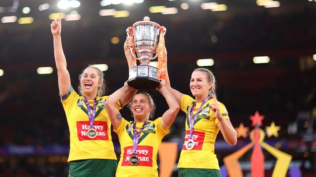 Kezie Apps, Samantha Bremner and Ali Brigginshaw celebrate victory in the Women's Rugby League World Cup final match between Australia and New Zealand at Old Trafford on November 19, 2022 in Manchester, England.Picture: Naomi Baker/Getty Images