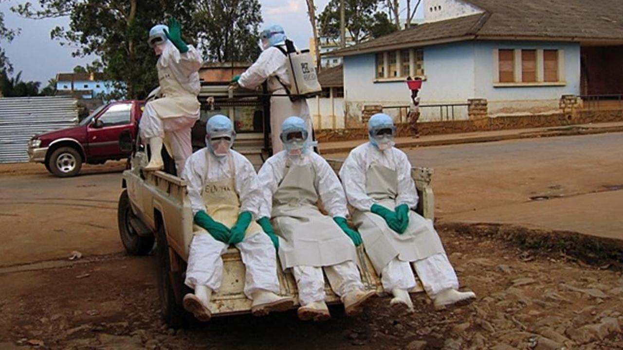 Health workers are seen in Angola in 2005 following another Marburg outbreak