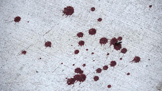 Some of the Blood on the footpath at the stabbing in Woodridge. Stabbing on Ewing Road, Woodridge.Sunday August 19, 2018. (AAP image, John Gass)