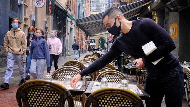 A Melbourne restaurant prepares for business on Sunday. Picture: NCA NewsWire/Luis Ascui