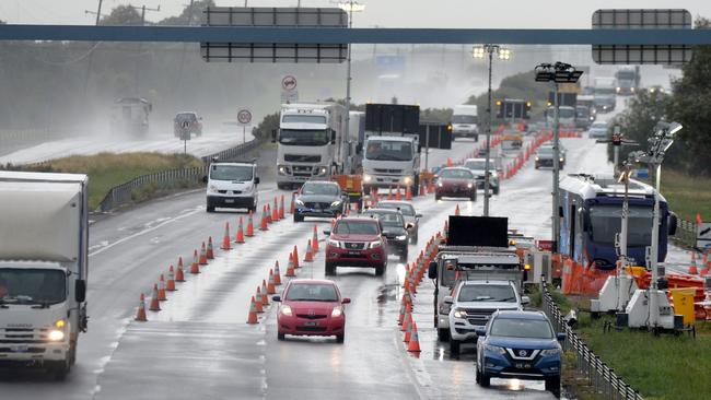 Geelong-bound traffic goes through a checkpoint on the Princes Freeway at Little River on Thursday. Picture: Andrew Henshaw