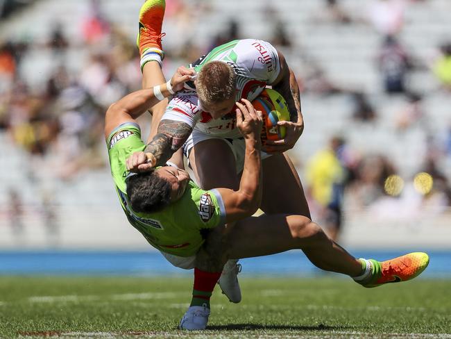 Aaron Gray is up-ended by Nick Cotric during the 2017 Auckland Nines match between Canberra and South Sydney at Eden Park. Picture: Getty Images