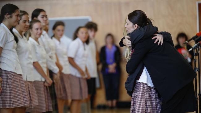 New Zealand's Prime Minister Jacinda Ardern, hugs and consoles a student during her visit to Cashmere High. Picture: AP Photo/Vincent Thian