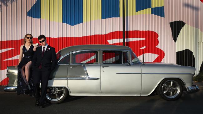 Robina State High School Year 12 formal at HOTA. Hannah Dalton and Samuel Green arrive in a Cheviot Bel Air. Picture: Glenn Hampson.
