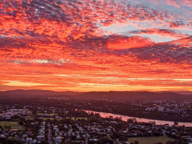 Sunset drone image over Brisbane looking towards Mt Coot-tha and the CBD. Photo - Ross Langdon