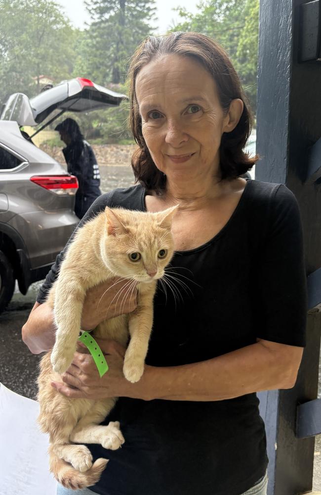 Debbie Johnson with Ginger the cat at the Nambour Evacuation Centre. Picture: Jarrod Tutbury