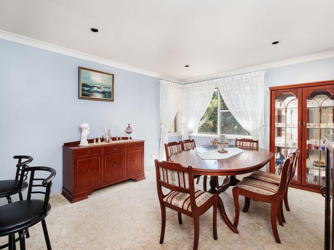 The carpeted formal dining room.