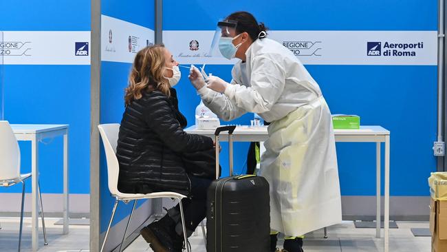 A passenger who just landed from New York undergoes a swab test for COVID-19. Picture: AFP