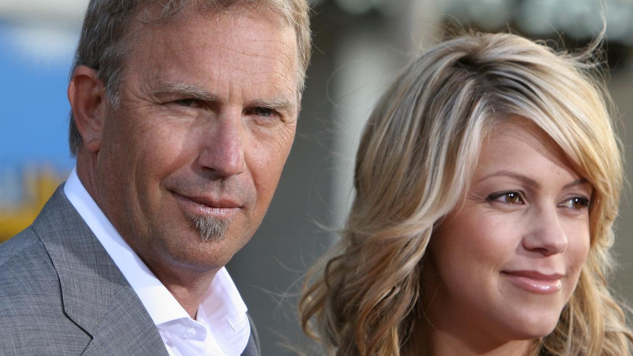 Kevin Costner (L) and his wife Christine Baumgartner. Picture: AFP PHOTO / ROBYN BECK