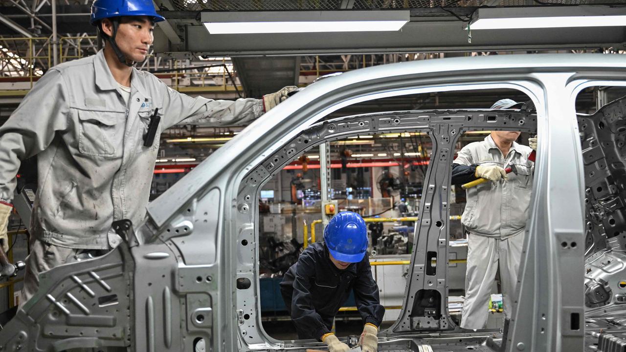 Employees work on an electric vehicle (EV) production line at the Leapmotor factory in Jinhua, China's eastern Zhejiang province. Picture: ADEK BERRY / AFP