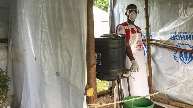 An ebola screening checkpoint where people crossing from Congo go through foot and hand washing with a chlorine solution and have their temperature taken, at the Bunagana border crossing with Congo in western Uganda. Picture: Ben Wise/International Rescue Committee via AP