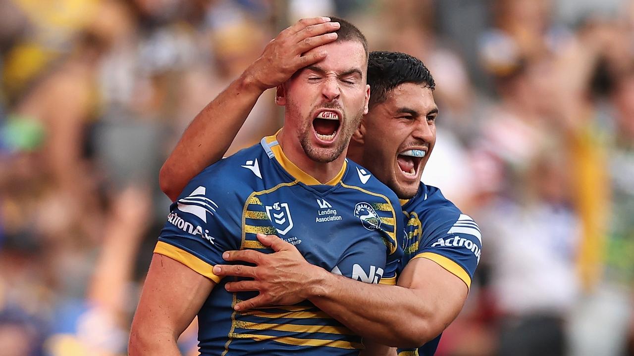 SYDNEY, AUSTRALIA - APRIL 18: Clinton Gutherson of the Eels celebrates scoring a try with team mate Dylan Brown of the Eels during the round six NRL match between the Parramatta Eels and the Wests Tigers at CommBank Stadium on April 18, 2022, in Sydney, Australia. (Photo by Cameron Spencer/Getty Images)