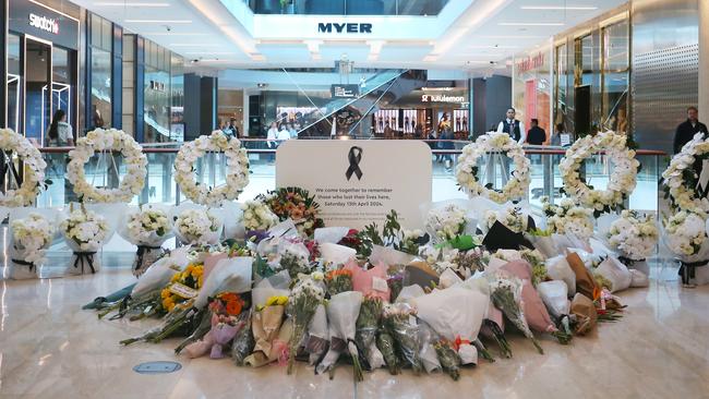 Floral tributes at a memorial site during the re-opening of the Westfield Bondi Junction shopping centre on Friday. Picture: Getty Images