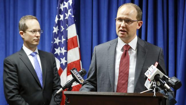 Herb Stapleton, FBI Assistant Special Agent in Charge, FBI, right, and US Attorney Benjamin C. Glassman, reveal details of the extradition of a Chinese intelligence operative has been charged with stealing trade secrets from multiple US aviation and aerospace companies. Picture: John Minchillo/AP