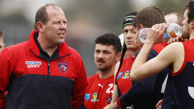 TSL North Hobart coach Richard Robinson addresses his team at quarter time. Picture: Zak Simmonds