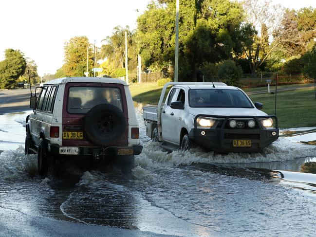 Rising flood waters from the Lachlan River make their way onto Bathurst Street in Forbes. Picture: Jonathan Ng