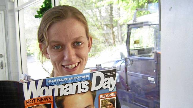 Jenny Mason of the Noosa Heads Shell Service station with the magazine featuring Prince William, which Prince Harry read through during a brief visit. Picture: Geoff Potter