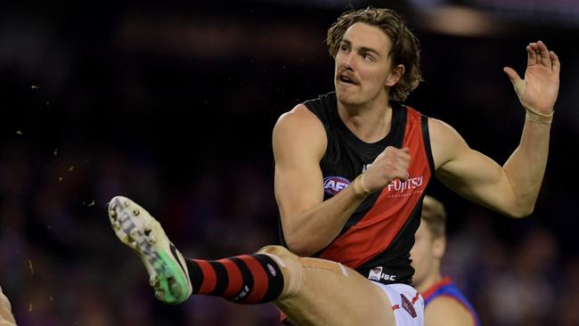 Joe Daniher of the Bombers kicks during the round 19 Western Bulldogs and Essendon Bombers match at Etihad Stadium in Melbourne, Sunday, July 30, 2017. (AAP Image/Tracey Nearmy) NO ARCHIVING, EDITORIAL USE ONLY