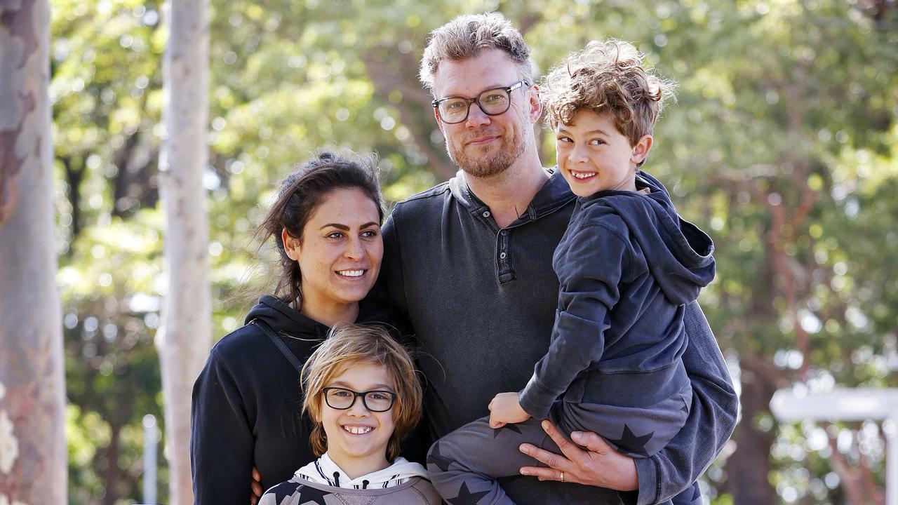 Magnus Perri with wife Dominique and kids Lucas (left) and Oliver (right) after spending the night at the zoo and being evacuated after the lions broke out. Picture: Sam Ruttyn