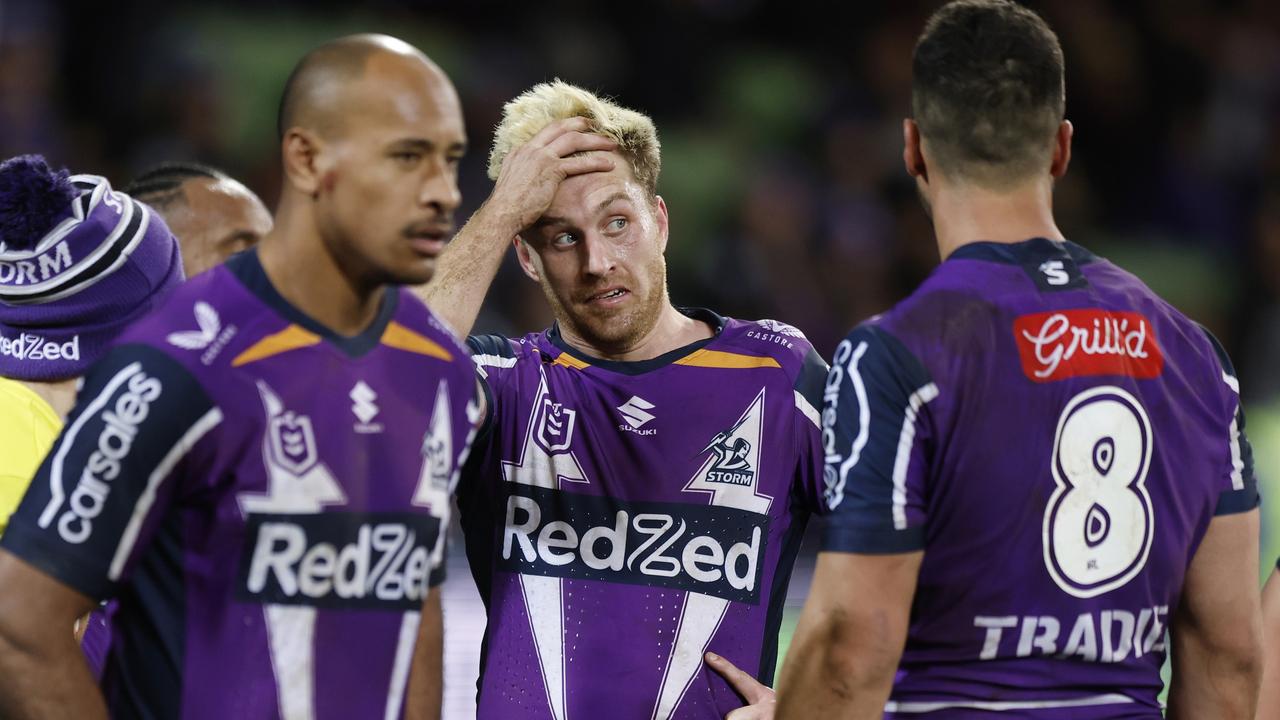 MELBOURNE, AUSTRALIA - JULY 17: Cameron Munster (C) of the Storm reacts with teammates during the round 18 NRL match between the Melbourne Storm and the Canberra Raiders at AAMI Park, on July 17, 2022, in Melbourne, Australia. (Photo by Mike Owen/Getty Images)