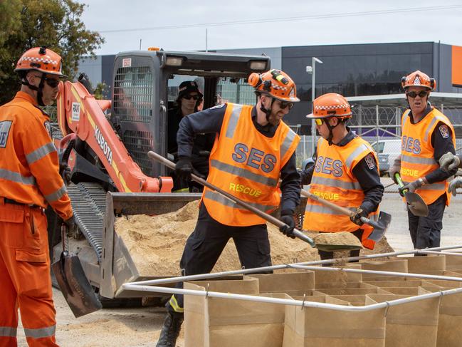 ADELAIDE, AUSTRALIA - NewsWire Photos NOVEMBER 10, 2022: SES Netley workers demonstrate the speed and ease of filling a DefenCell with sand which can be used as a levee during flooding. Picture NCA NewsWire / Emma Brasier