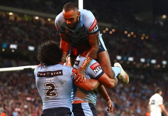 Stacks on Latrell Mitchell after his try (Photo by Chris Hyde/Getty Images)