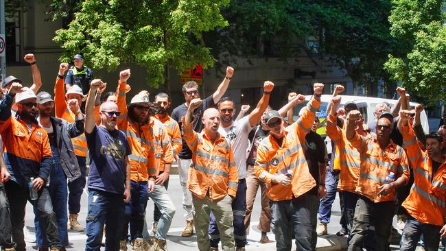 MELBOURNE AUSTRALIA - NewsWire Photos DECEMBER 13, 2024. CFMEU members strike outside Fair Work Australia offices against the sacking of CFMEU official Esther Van Arend.Picture: NewsWire / Luis Enrique Ascui