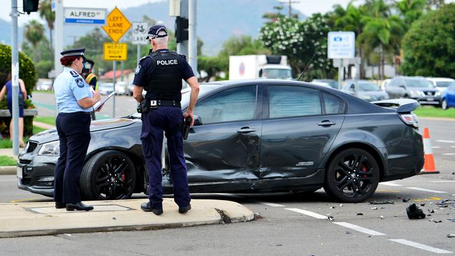 Emergency services at the scene of a fatal crash between a motorcycle and car. Picture: Alix Sweeney