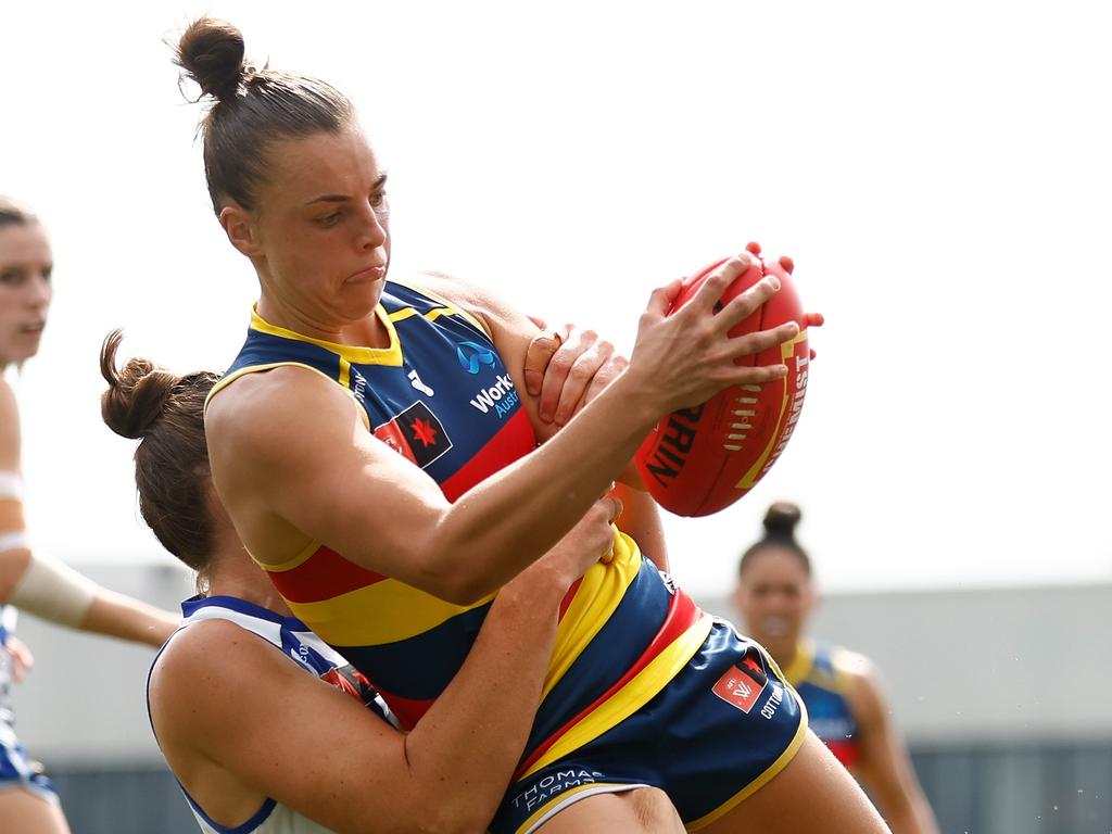 Ebony Marinoff of the Crows is tackled by Emma King. Picture: Michael Willson/AFL Photos via Getty Images