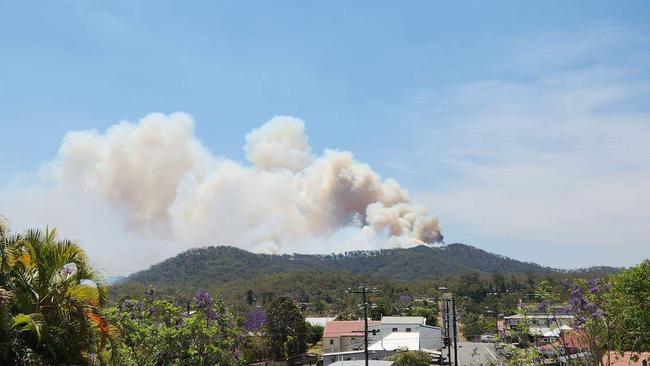 A bushfire burning on the ridge line behind the Atherton Tablelands town of Herberton on Wednesday. Picture; Supplied