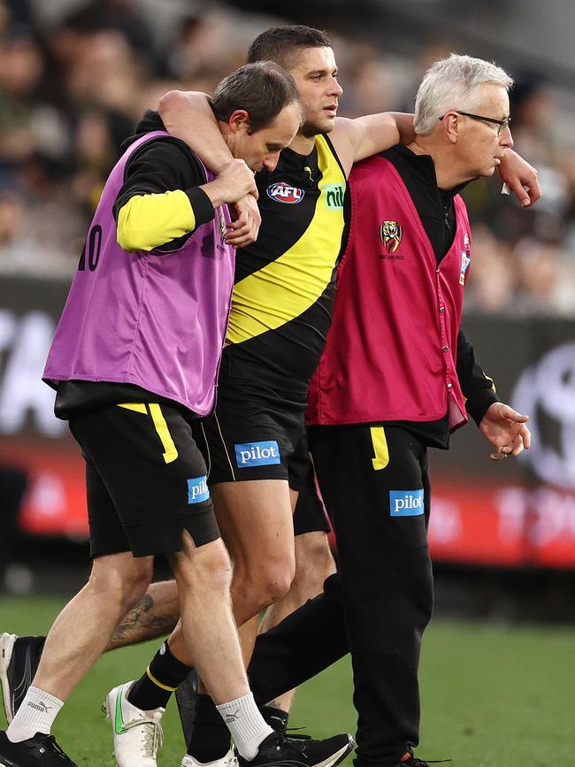 Dion Prestia is helped from the field. Picture: Michael Klein.