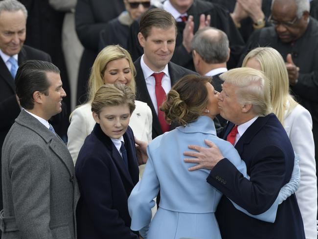 President Donald Trump kisses his wife Melania Trump with his family after taking the oath of office during the 58th Presidential Inauguration at the U.S. Capitol in Washington on January 20, 2017. Picture: AP