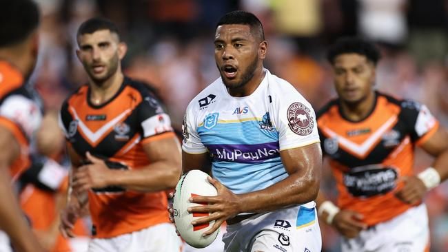 SYDNEY, AUSTRALIA - MARCH 05: Moeaki Fotuaika of the Titans runs the ball during the round one NRL match between the Wests Tigers and the Gold Coast Titans at Leichhardt Oval on March 05, 2023 in Sydney, Australia. (Photo by Cameron Spencer/Getty Images)