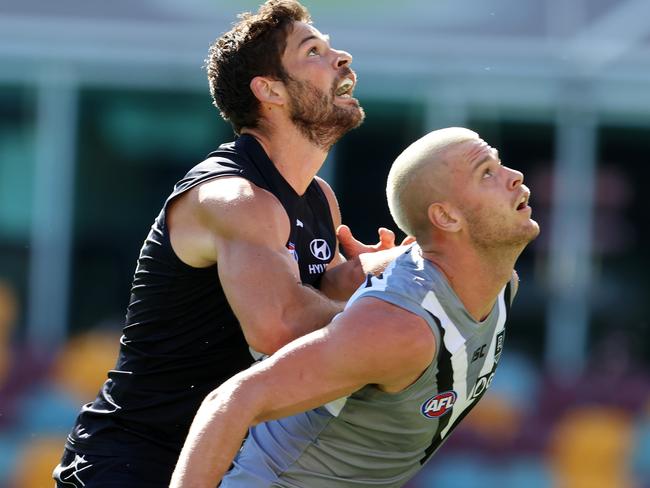 AFL Round 7. Carlton vs Port Adelaide at the Gabba, Brisbane. 19/07/2020.  Levi Casboult of the Blues and Peter Ladhams of the Power battle in the ruck   . Pic: Michael Klein