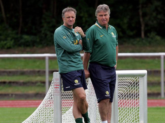 Guus Hiddink (right) chats with his then Socceroos assistant coach Graham Arnold in 2006. Picture: Gregg Porteous