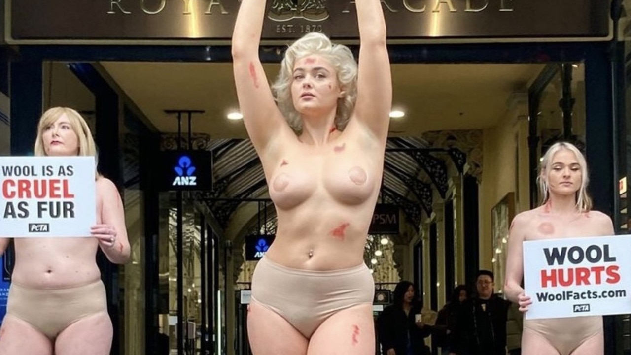 Tash Peterson (R) performing a topless protest in Melbourne's CBD last week.