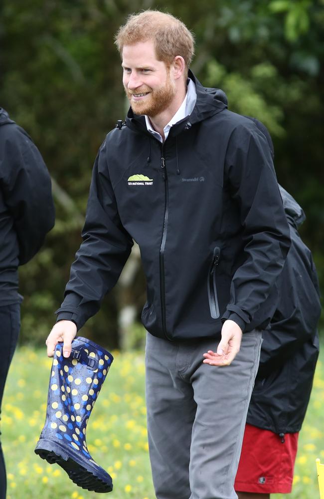 Harry also gave the gumboot-throwing challenge a shot. Picture: Getty Images