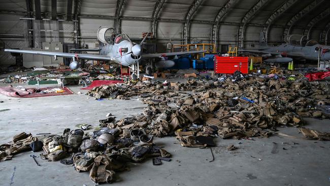 Afghan Air Force A-29 attack jets surrounded by armoured vests in a hangar at the airport in Kabul. Picture: AFP